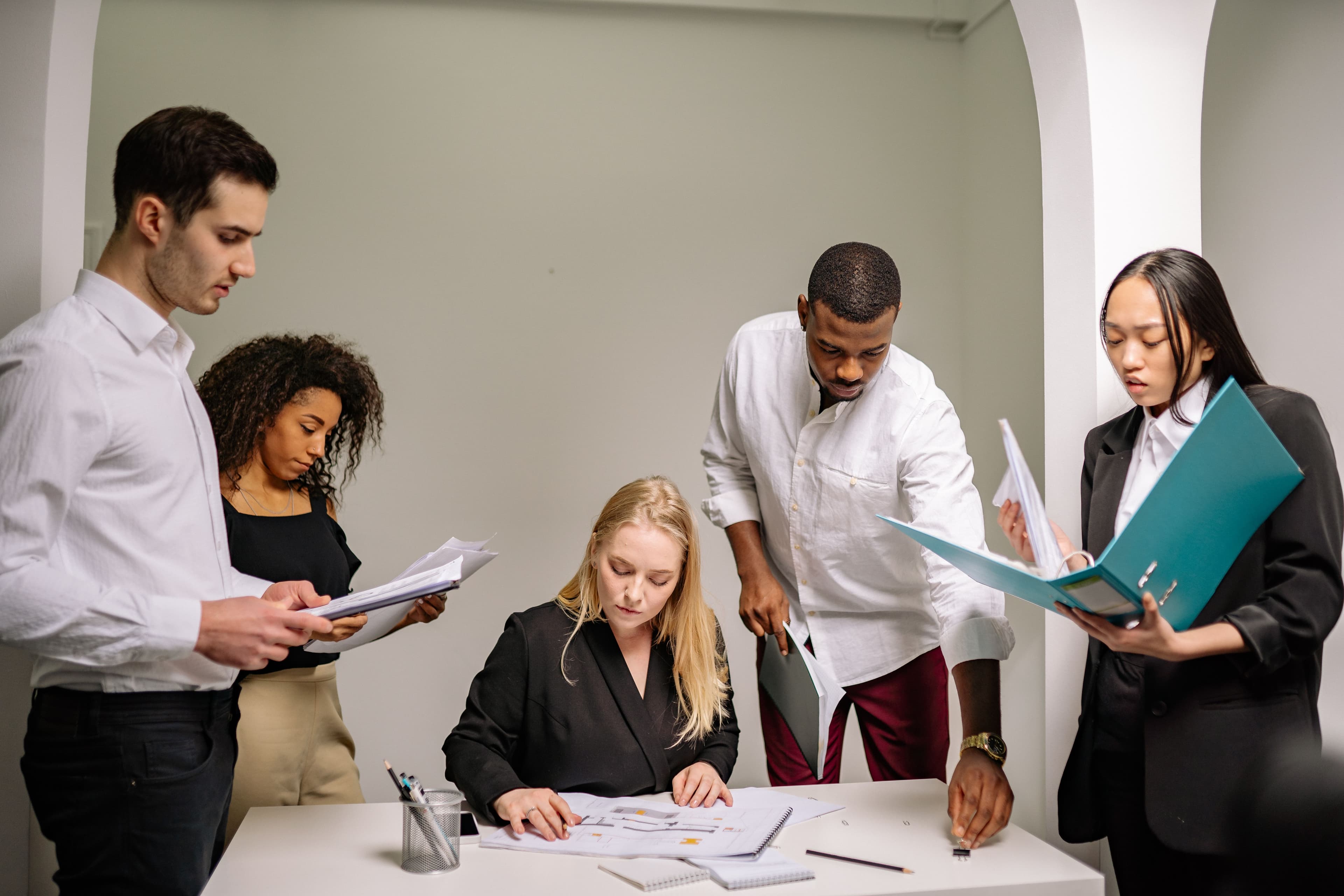 A team presenting and discussing ideas together in a workshop