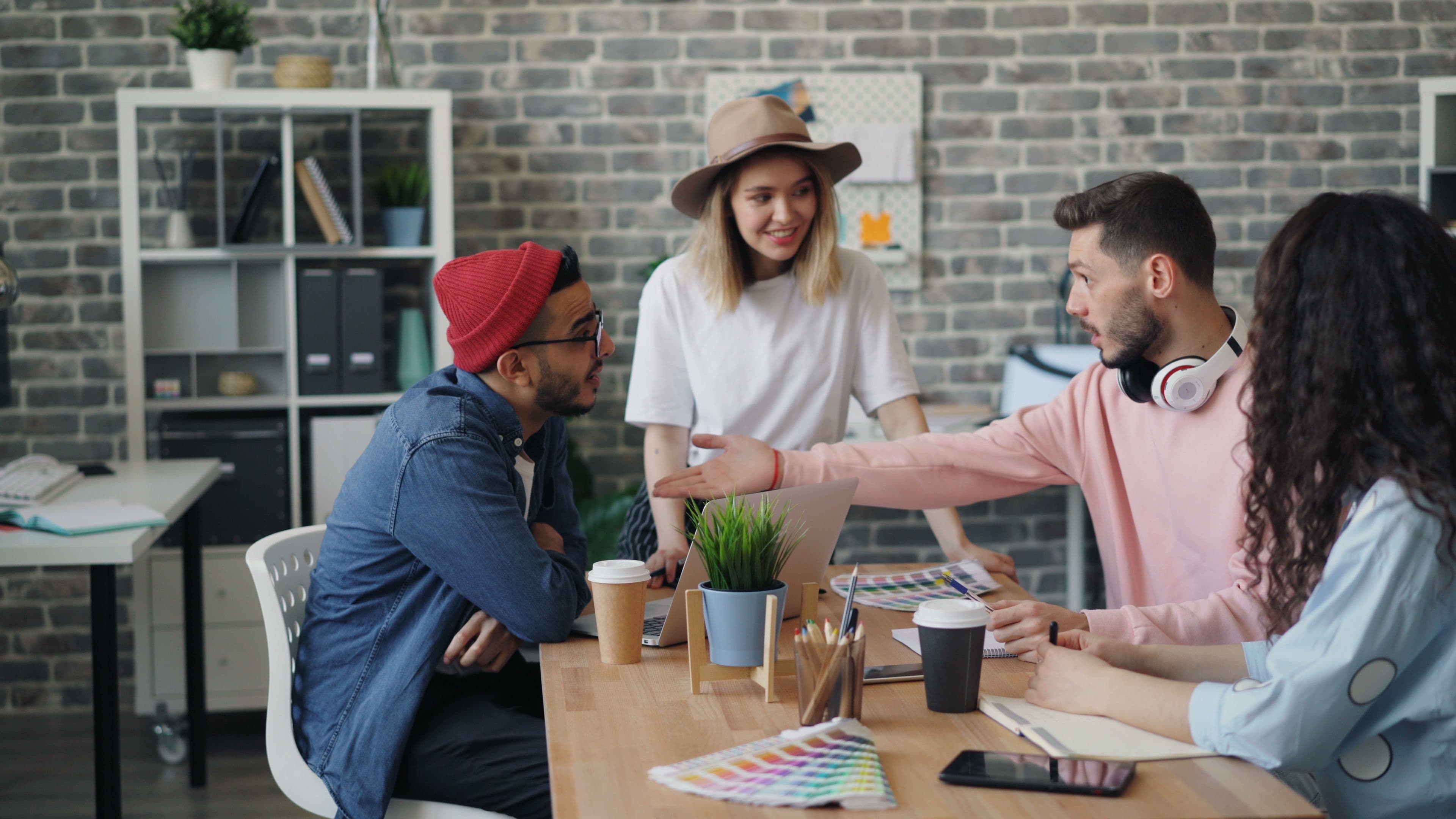 A small team collaborating around a desk